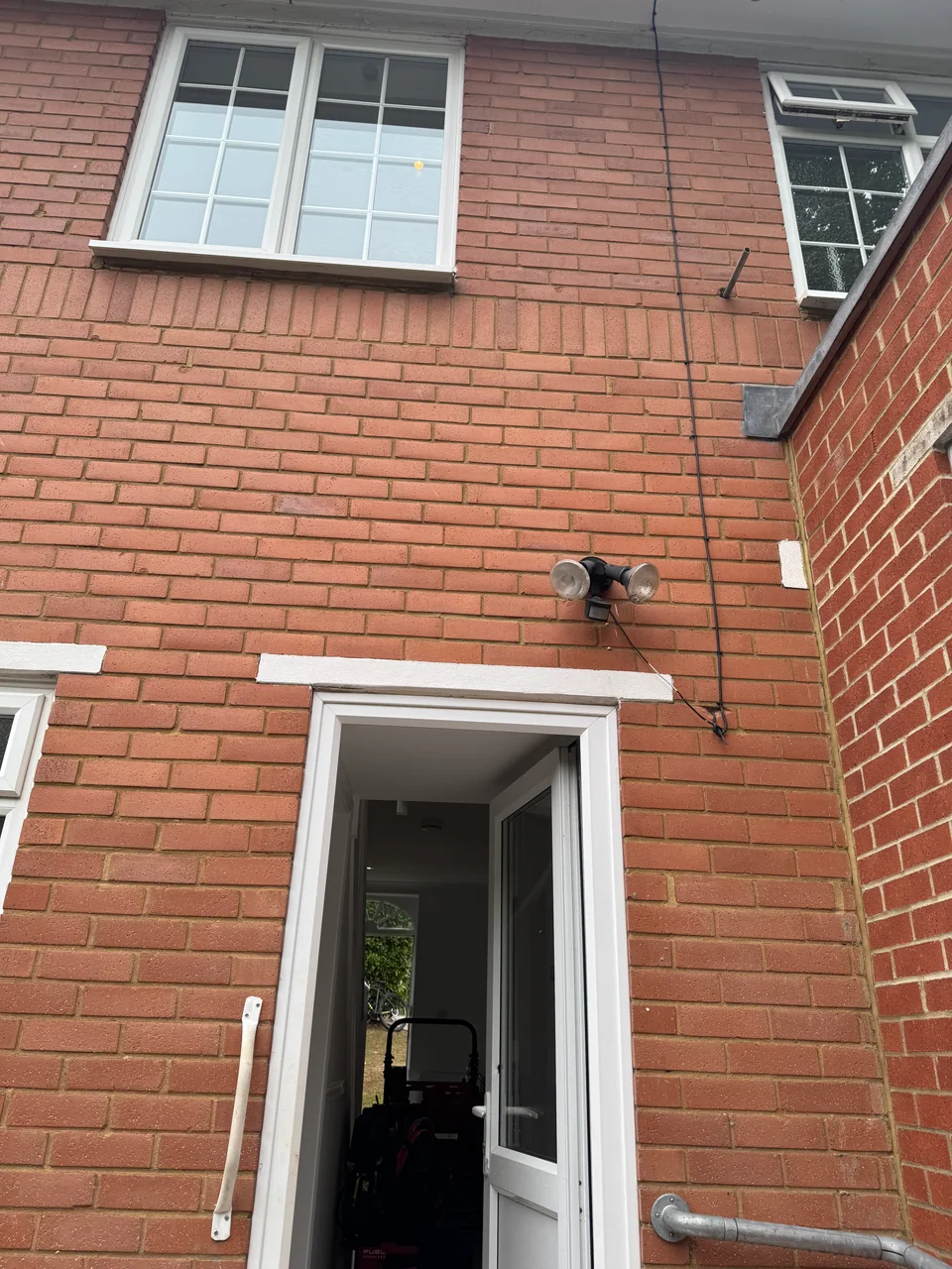 Rear elevation during external security light installation